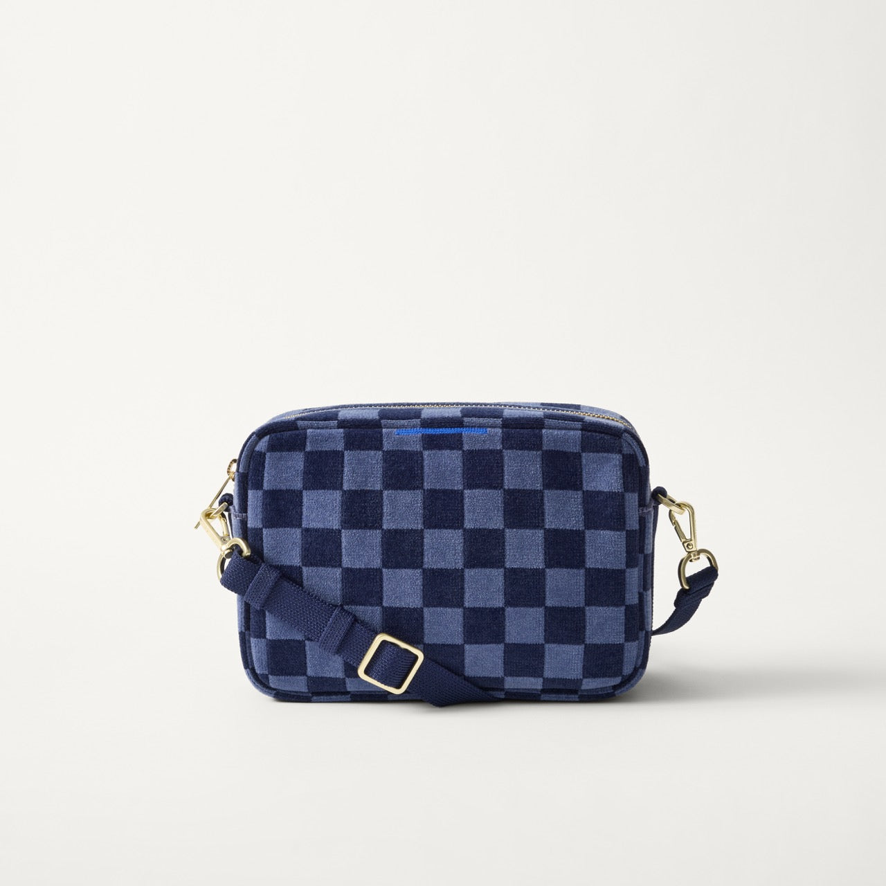 EXT | The Crossbody Camera Bag in  ReVelvet™ Blue Ink, shown from the front. 