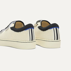 Close up of the heel of The Kids Strap Sneaker in Chess Open-Knit, with Rothy's signature blue halo. 
