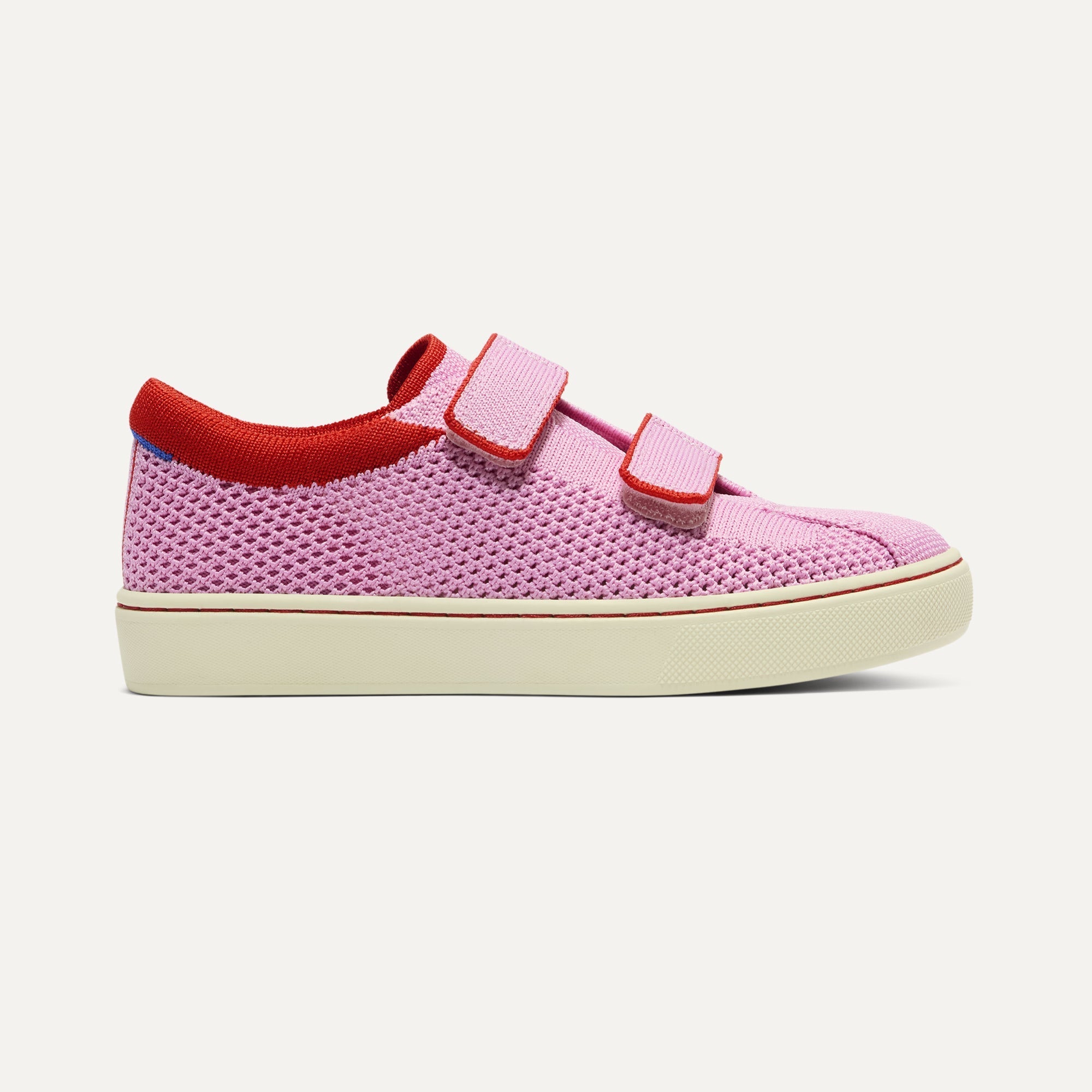 side | The Kids Strap Sneaker in Tutu Open-Knit shown from the side. 